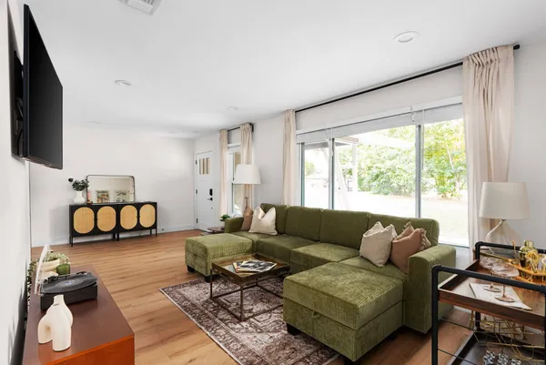 a living room with furniture and a large window