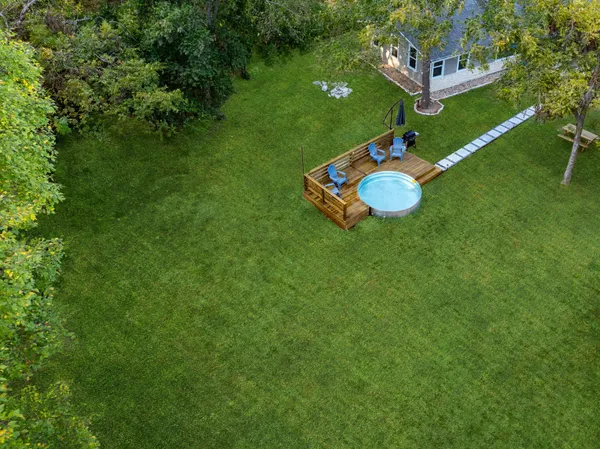 a view of a table and chairs in the garden