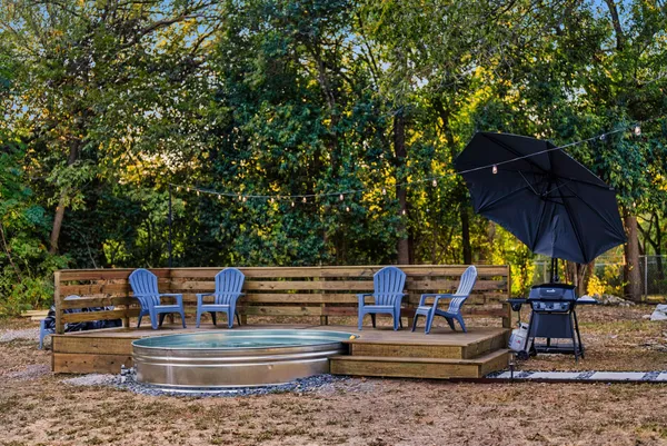 a view of house with outdoor seating area