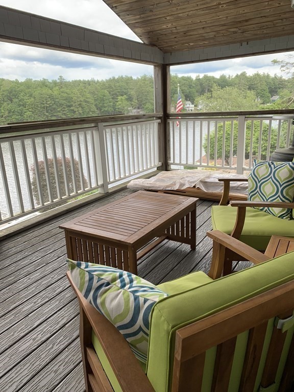 3 Pine Tree Drive Holland, MA 01521 - Photo 13 of 31 a roof deck with a table and chairs