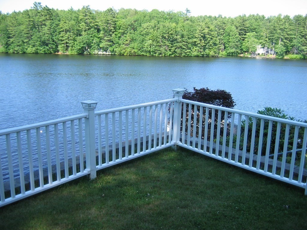 3 Pine Tree Drive Holland, MA 01521 - Photo 16 of 31 a view of a backyard with a lake