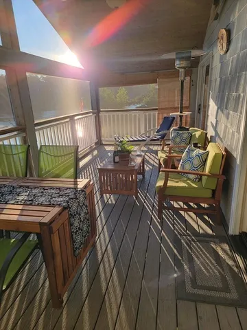 a view of a balcony with chairs