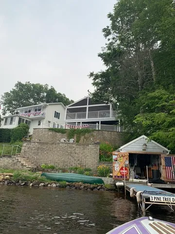 a front view of a house with a lake view