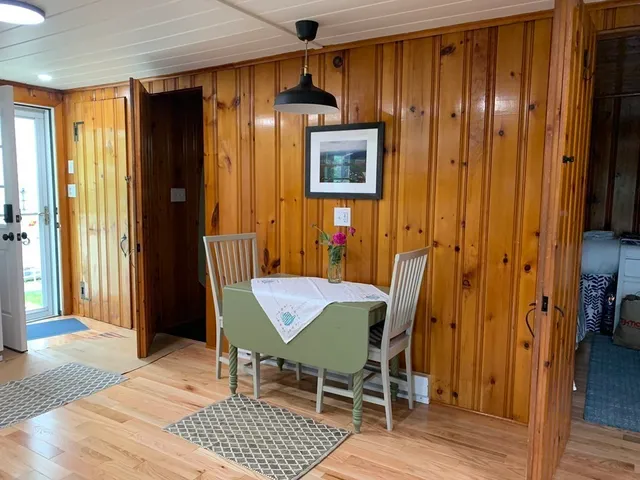 a dining room with furniture and window