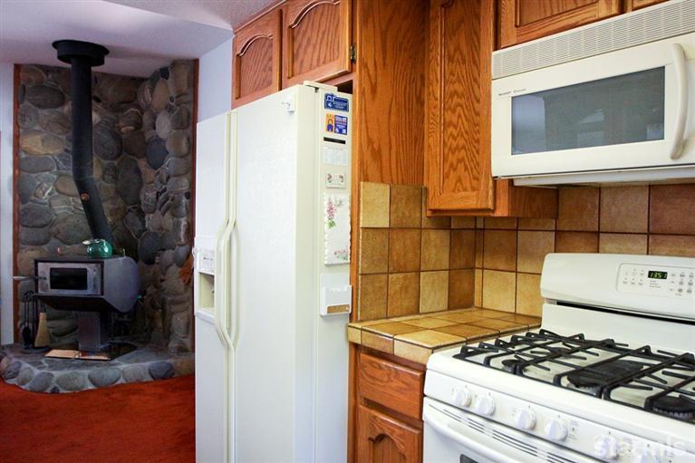 272 Chimney Rock Road Stateline, NV 89449 - Photo 26 of 35 a kitchen with a stove and a refrigerator