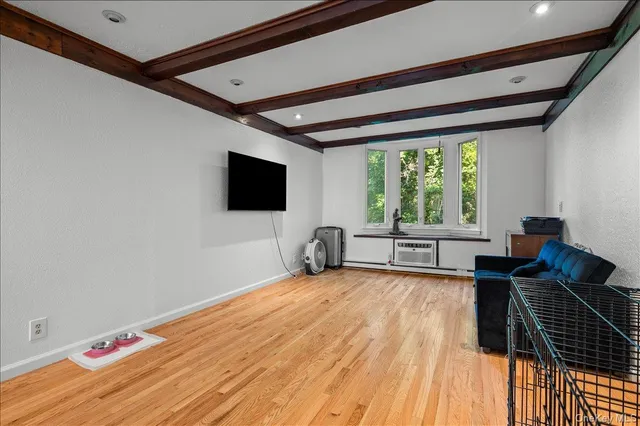 a view of a livingroom with wooden floor