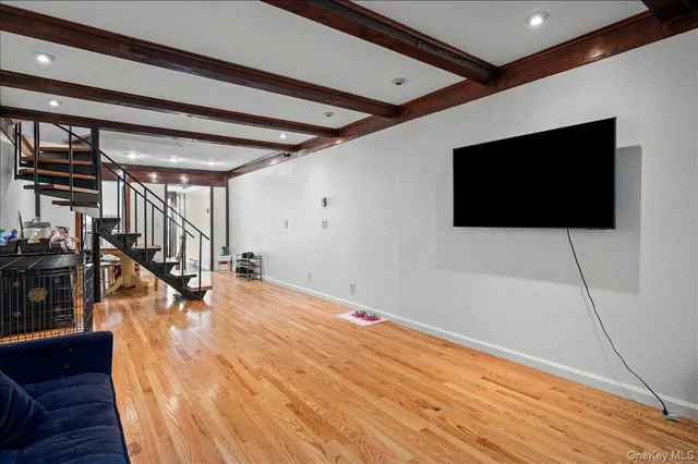 a livingroom with wooden floor and furniture