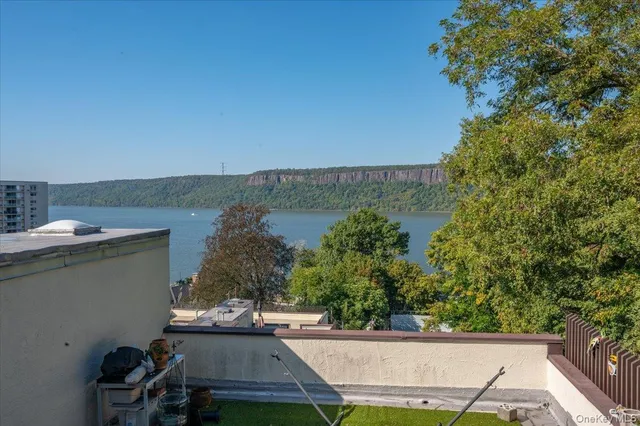 a view of a street with a building in the background
