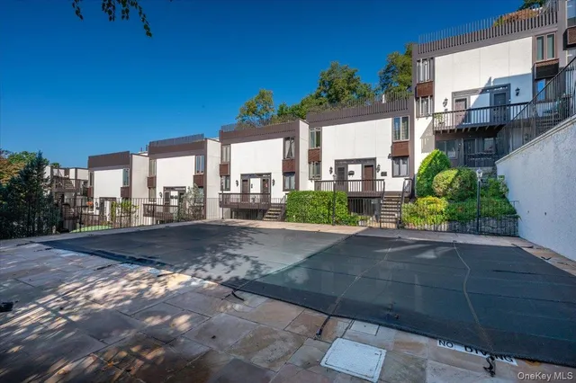 a couple of potted plants in front of door