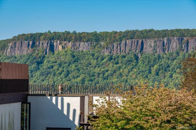 a view of a house with a flower garden