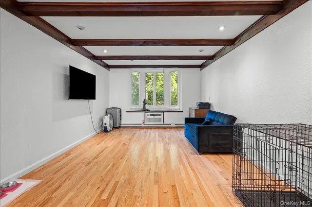 a room with furniture and a flat screen tv