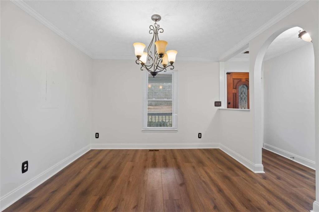 2284 Alcovy Station Road Covington, GA 30014 - Photo 16 of 45 a view of empty room with wooden floor and fan