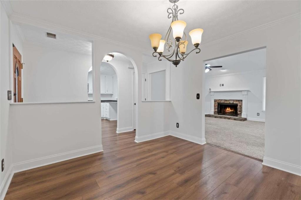 2284 Alcovy Station Road Covington, GA 30014 - Photo 17 of 45 a view of a room with wooden floor and ceiling fan