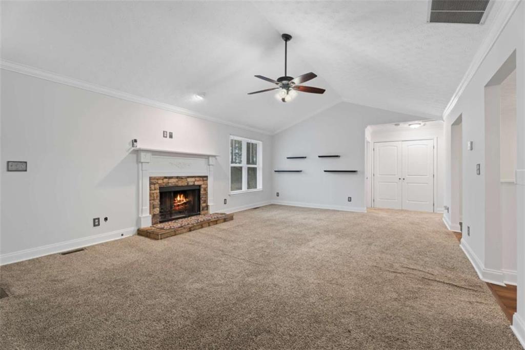 2284 Alcovy Station Road Covington, GA 30014 - Photo 18 of 45 a view of empty room with a fireplace
