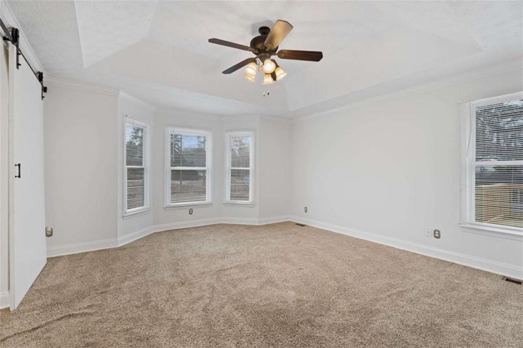 2284 Alcovy Station Road Covington, GA 30014 - Photo 22 of 45 a view of an empty room with a window