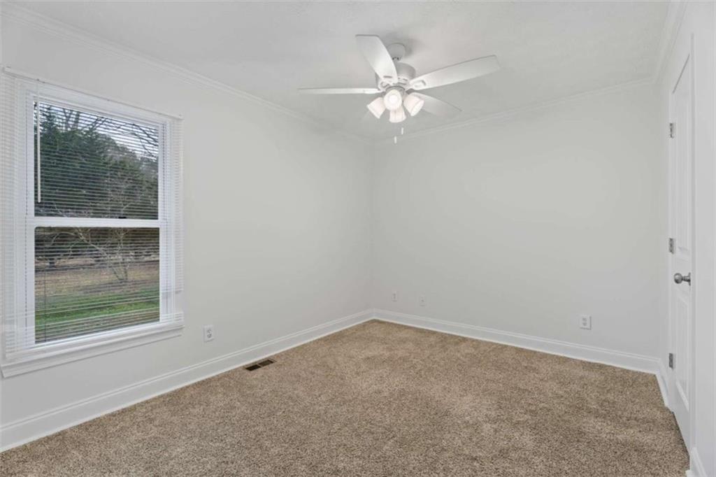 2284 Alcovy Station Road Covington, GA 30014 - Photo 30 of 45 a view of a small space with wooden floor and a window