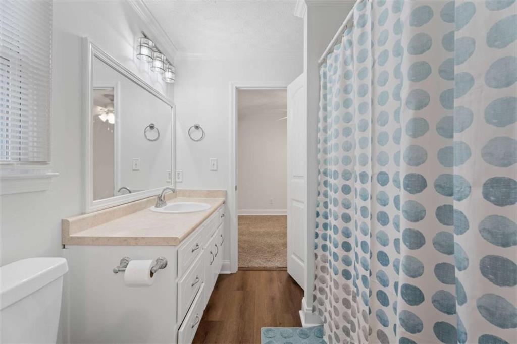 2284 Alcovy Station Road Covington, GA 30014 - Photo 32 of 45 a spacious bathroom with a sink and a mirror