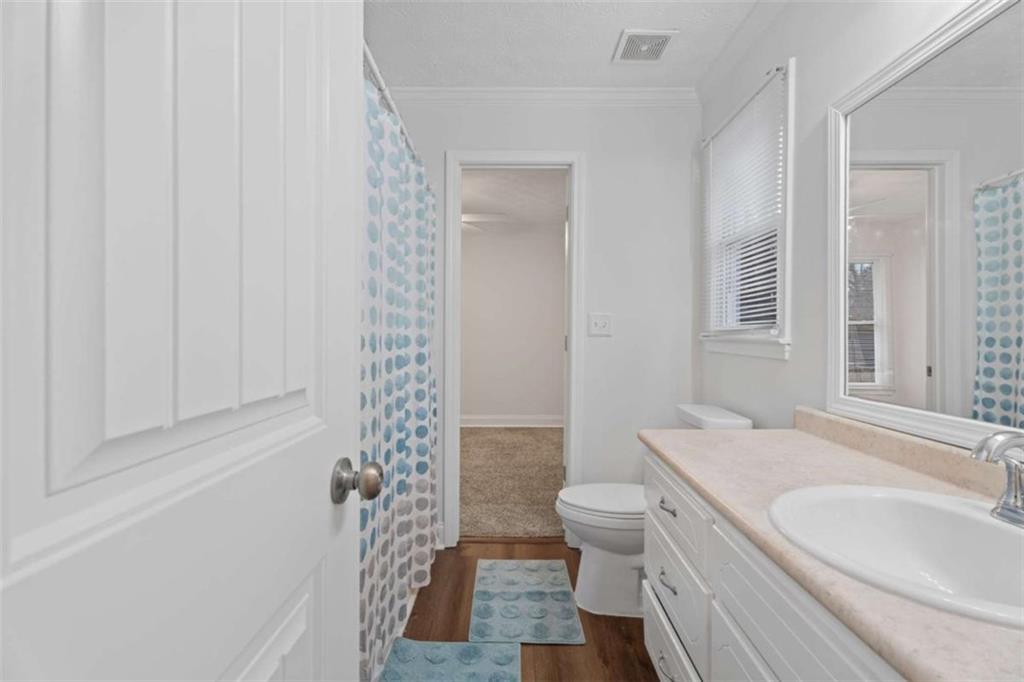 2284 Alcovy Station Road Covington, GA 30014 - Photo 33 of 45 a bathroom with a sink a toilet a tub and shower