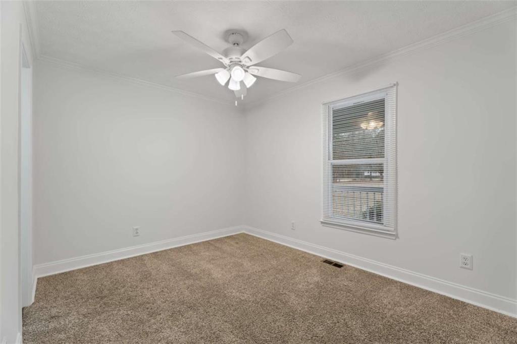 2284 Alcovy Station Road Covington, GA 30014 - Photo 34 of 45 an empty room with windows