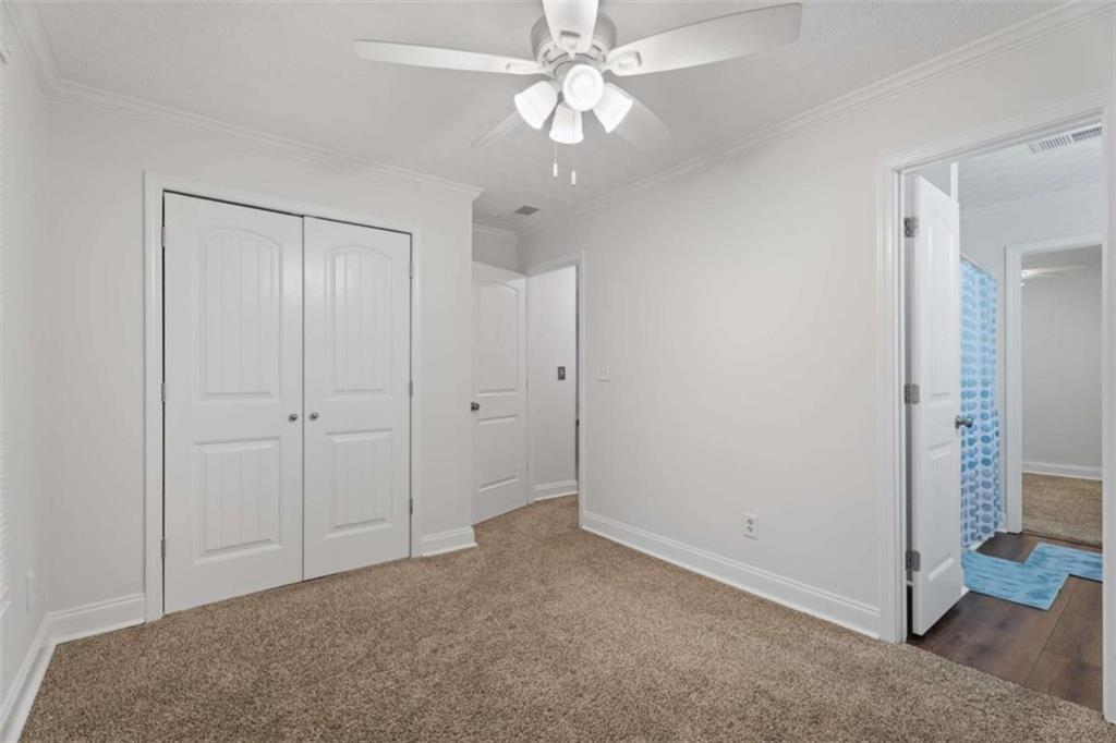 2284 Alcovy Station Road Covington, GA 30014 - Photo 35 of 45 wooden floor in an empty room with a bathroom