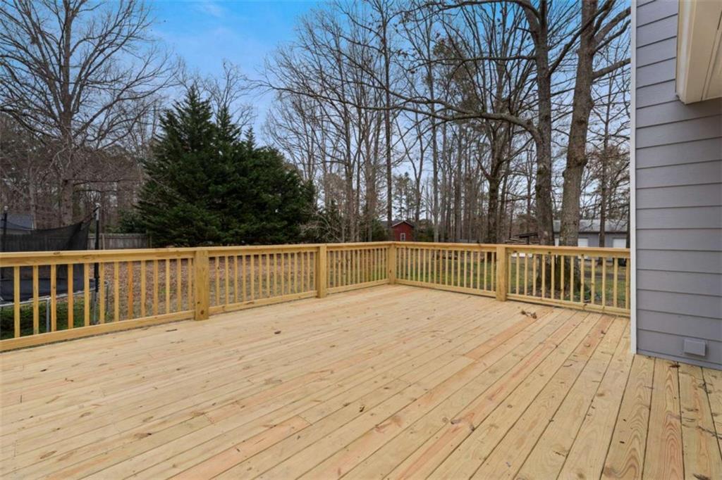 2284 Alcovy Station Road Covington, GA 30014 - Photo 36 of 45 a view of backyard with wooden floor and fence