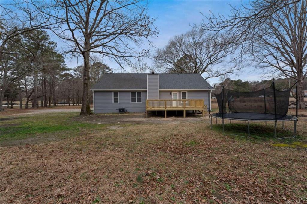 2284 Alcovy Station Road Covington, GA 30014 - Photo 39 of 45 a view of a house with a yard