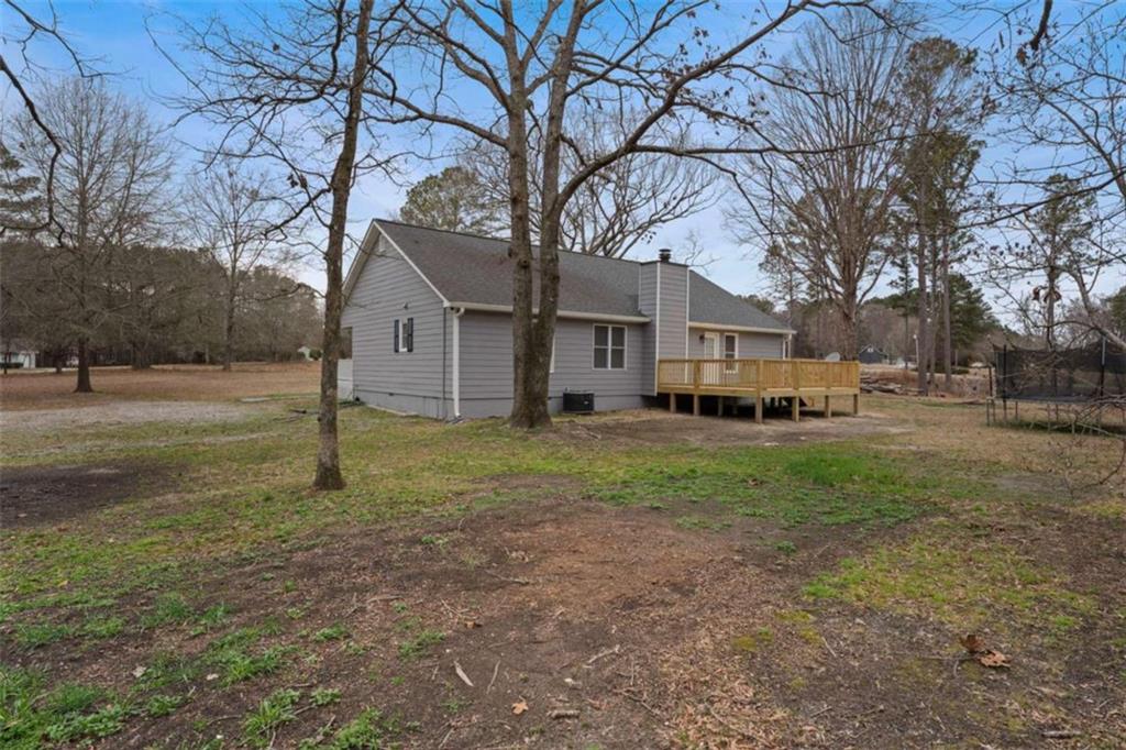 2284 Alcovy Station Road Covington, GA 30014 - Photo 41 of 45 a view of a yard with a house and a tree