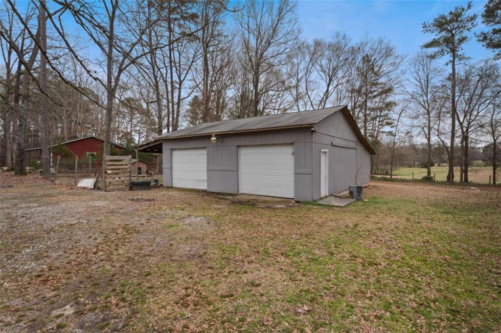 2284 Alcovy Station Road Covington, GA 30014 - Photo 5 of 45 a view of a house with a yard and garage