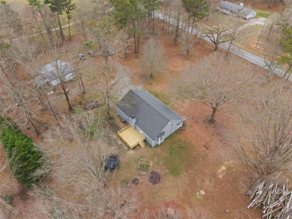 2284 Alcovy Station Road Covington, GA 30014 - Photo 6 of 45 a view of a dry yard with wooden fence
