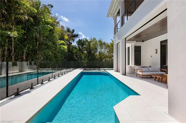 a view of a swimming pool with a patio
