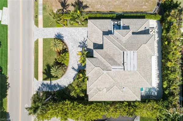 an aerial view of a house with a garden and plants