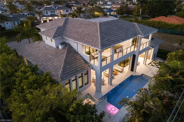an aerial view of a house roof deck and outdoor seating