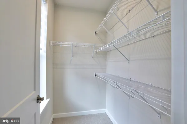 a view of a room with racks on the wall