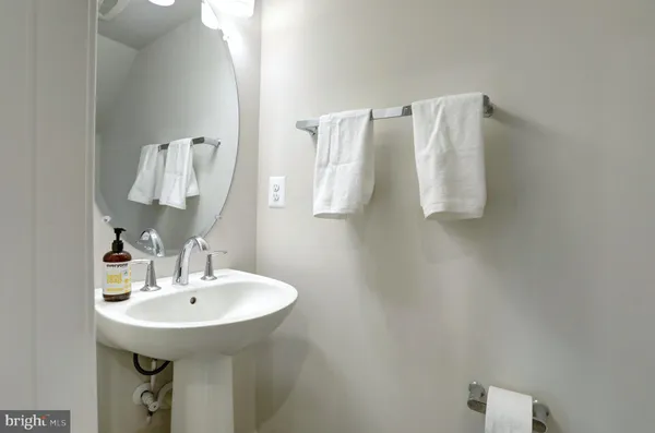 a bathroom with a sink and mirror