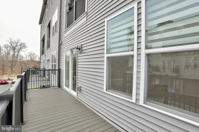 a view of a balcony with wooden floor