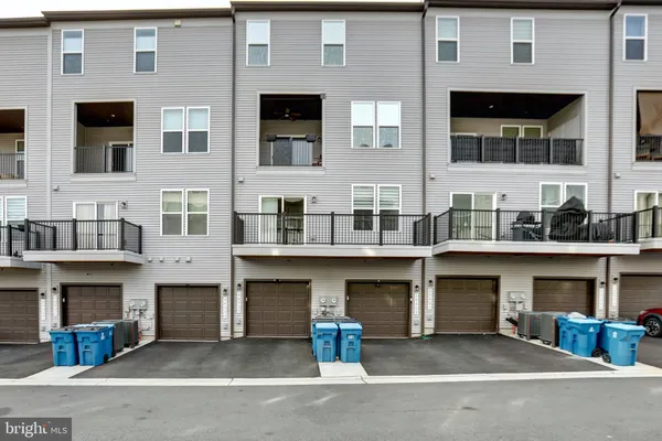 a front view of a brick house with many windows