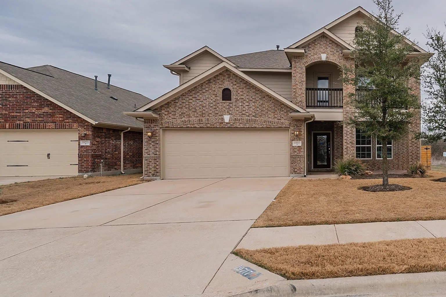 a front view of a house with garage and garage