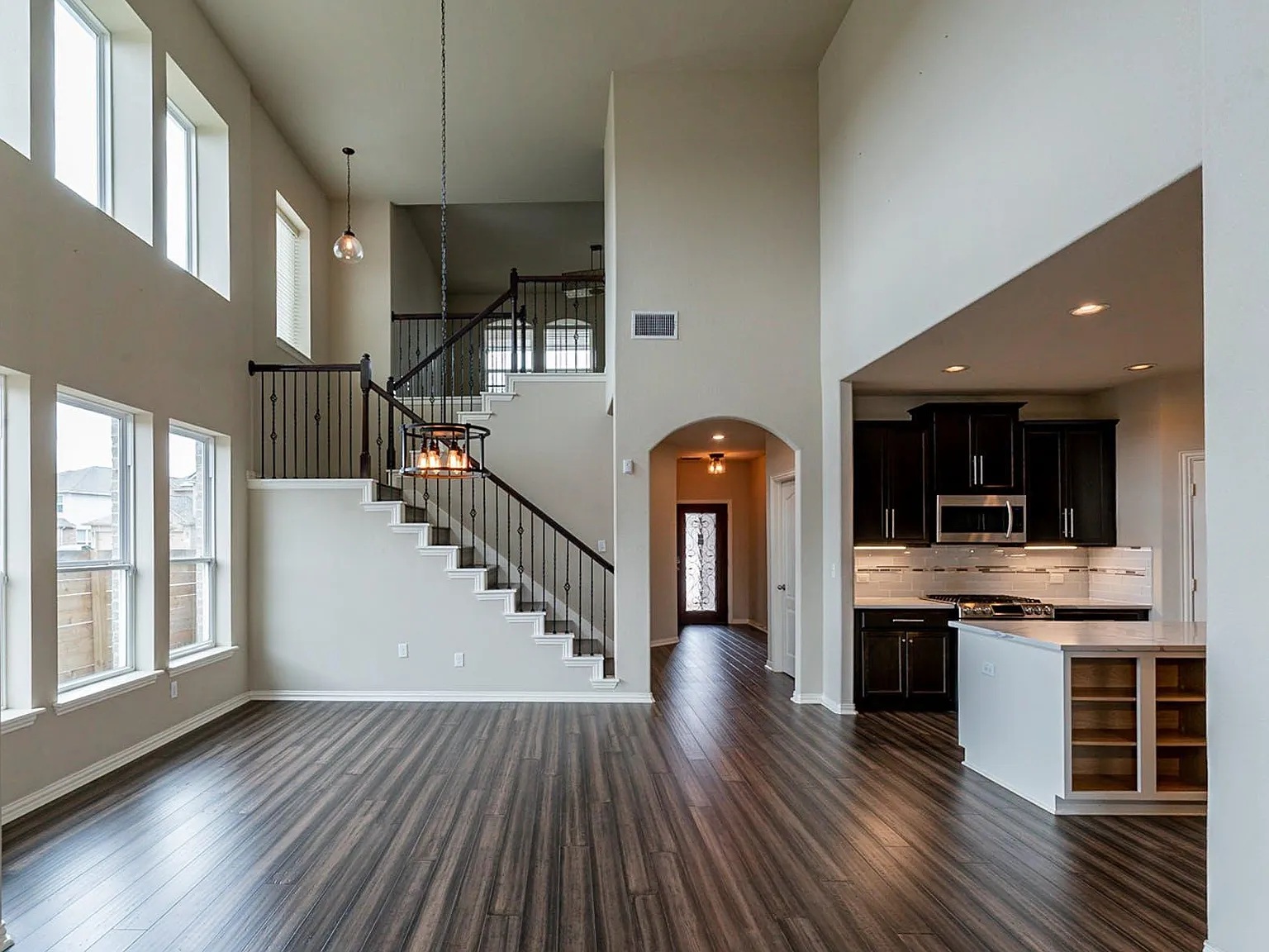 19717 Abigail Way Pflugerville, TX 78660 - Photo 2 of 9 a view of dinning room with wooden floor and pendant lights