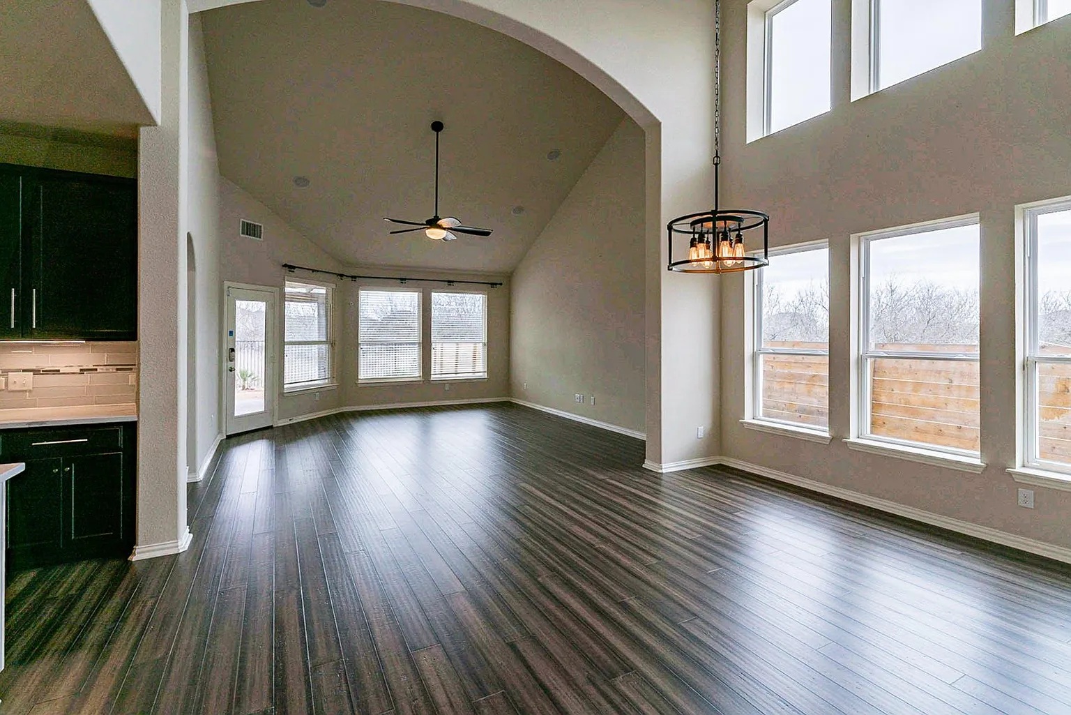 19717 Abigail Way Pflugerville, TX 78660 - Photo 4 of 9 wooden floor in an empty room with a window