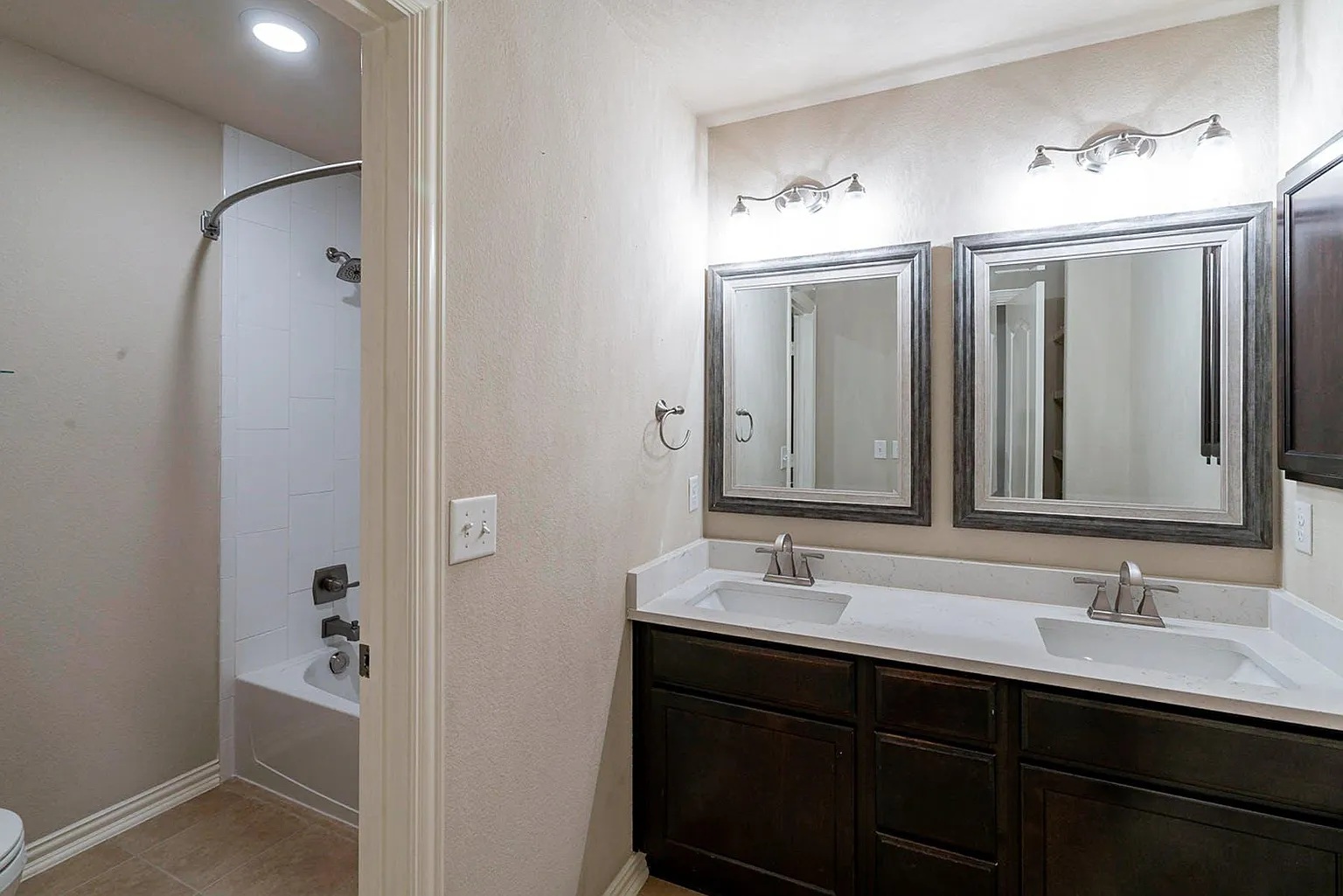 19717 Abigail Way Pflugerville, TX 78660 - Photo 8 of 9 a bathroom with a double vanity sink and mirror