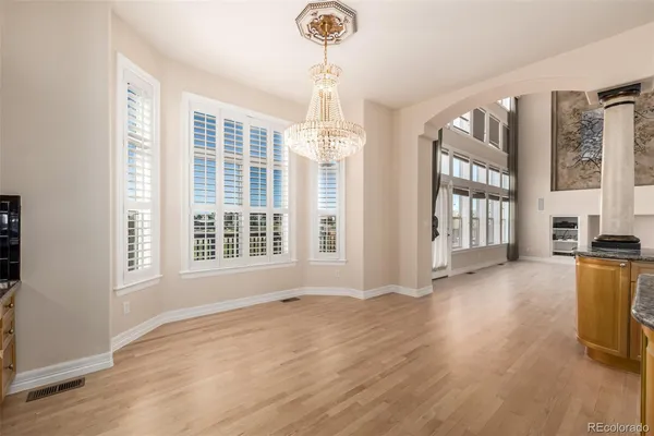 a view of livingroom with furniture wooden floor and windows