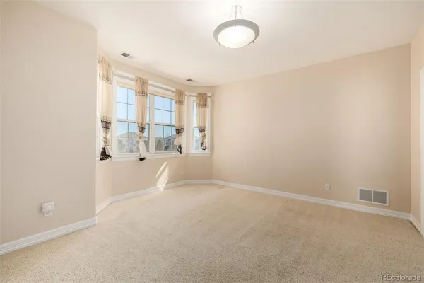 a view of a room with window and cabinet