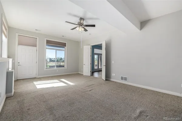 a view of an empty room with a window