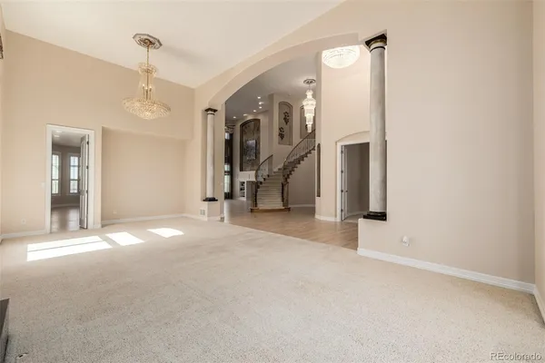 a view of a big room with closet and windows