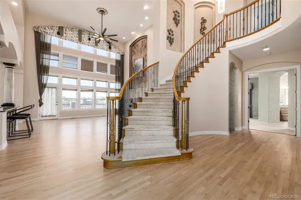 a view of entryway and hall with wooden floor