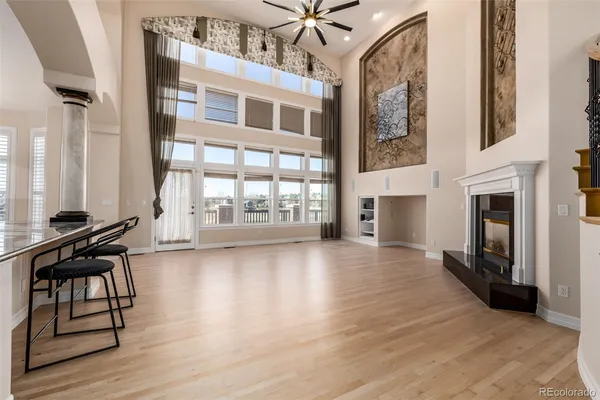 a view of a livingroom with furniture and a fireplace