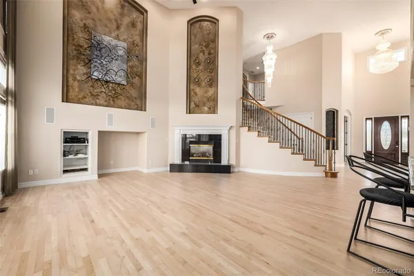 a view of a livingroom with furniture and staircase