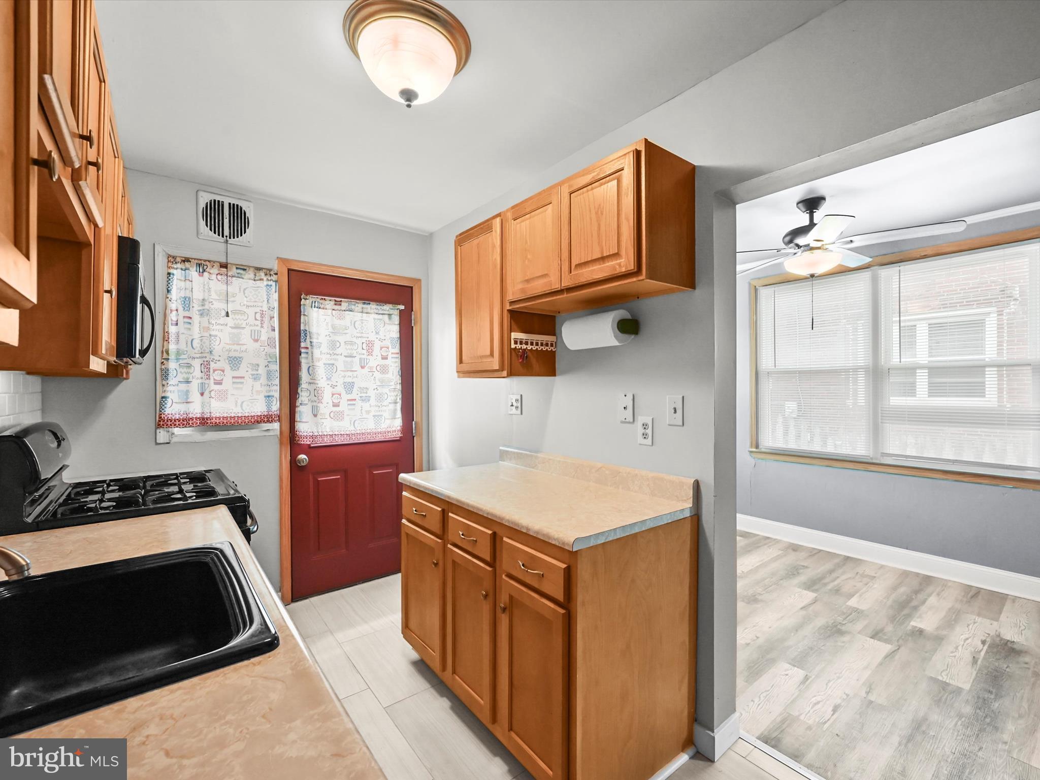 1913 Nevill Road Baltimore, MD 21222 - Photo 11 of 37 a kitchen that has a sink and a stove