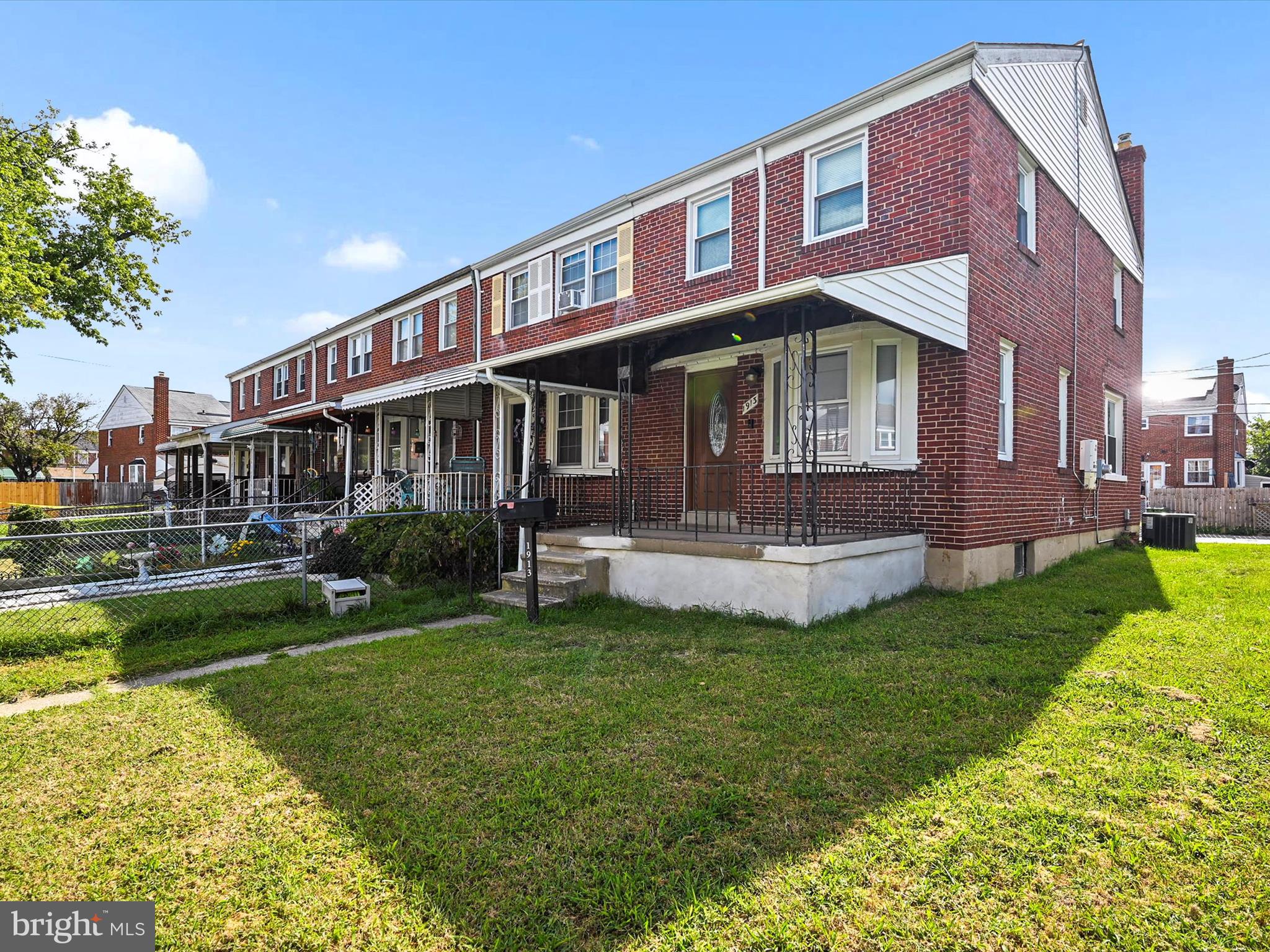 1913 Nevill Road Baltimore, MD 21222 - Photo 2 of 37 a front view of a house with a garden and swimming pool