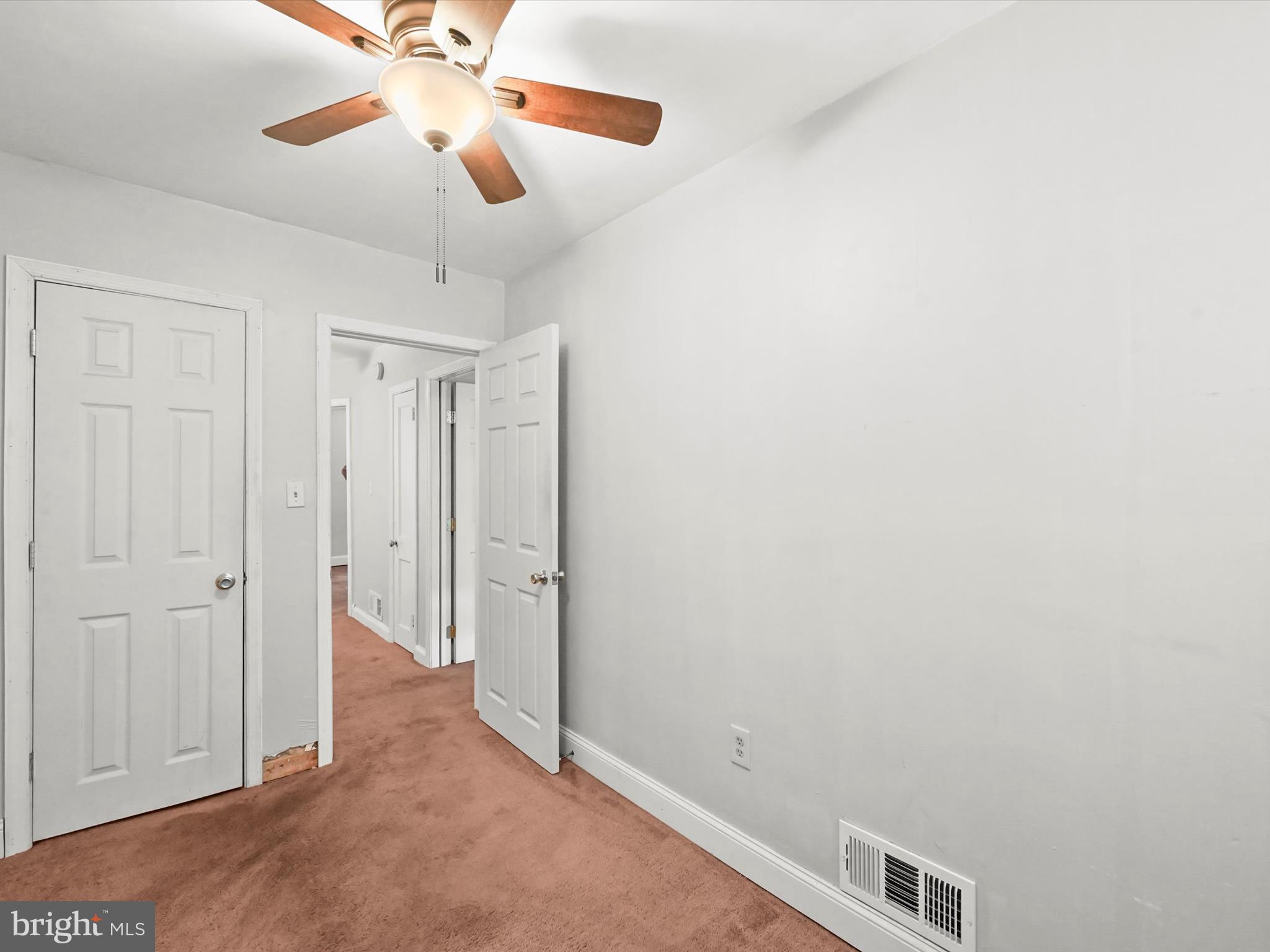 1913 Nevill Road Baltimore, MD 21222 - Photo 26 of 37 a view of a hallway with a chandelier fan